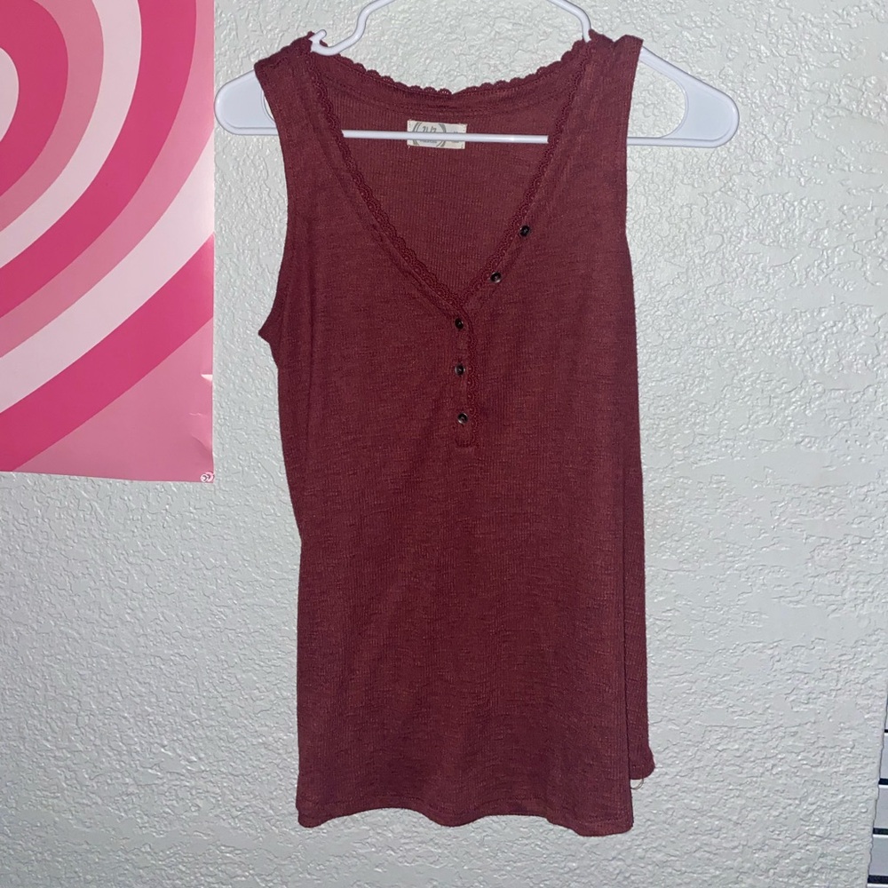 Maurice’s maroon tank top